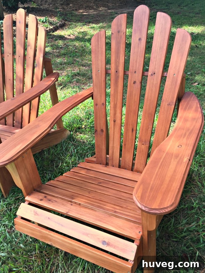 Newly stained Adirondack chairs arranged in the backyard