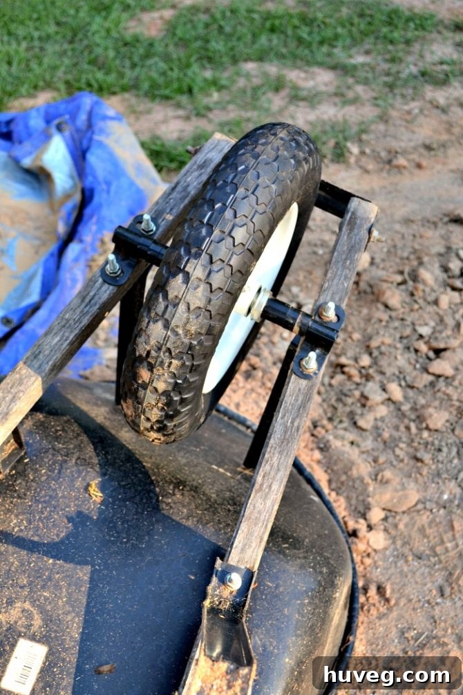 adding new universal flat free tire to wheelbarrow