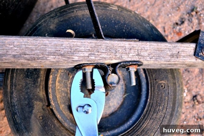 unscrew bolts to release old tire