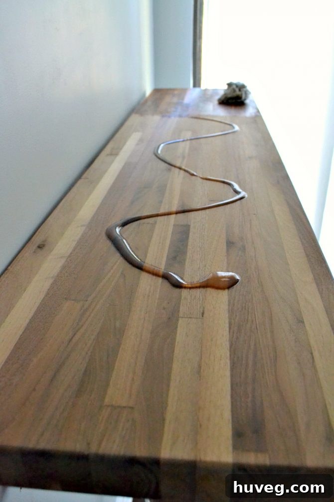 Newly oiled walnut kitchen bar showcasing its rich, enhanced grain and warm, deep tones.