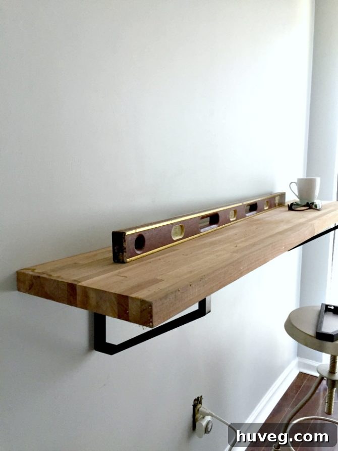 Left side view of the newly installed, unfinished small kitchen bar awaiting its protective finish.