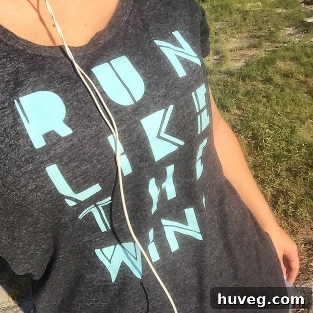 Woman running outdoors, symbolizing the importance of physical activity and socialization for remote workers.