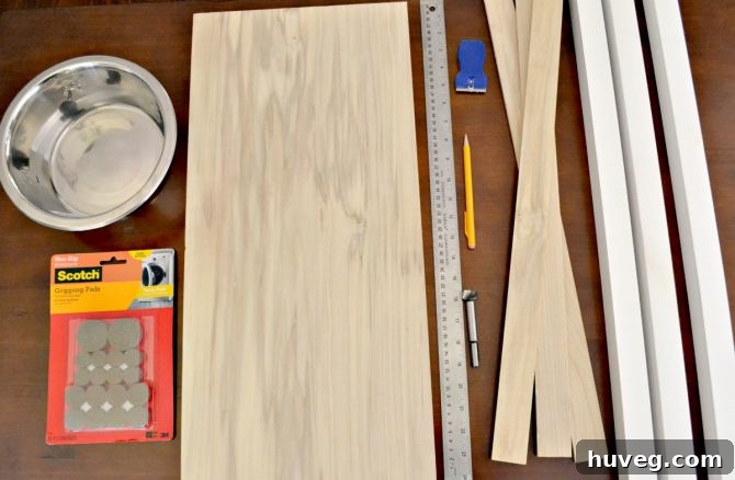 For this no-slip dog feeder, you’ll need wood, measuring tape, metal food bowls, a ruler, pencil, and non-slip footpads.
