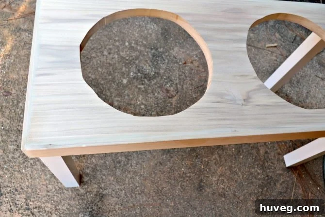 After the legs are on your DIY dog feeder, you’ll need to sand and fill any gaps.