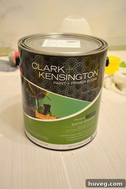 A gallon of Clark + Kensington paint in Winter Chill sitting in the bathroom.