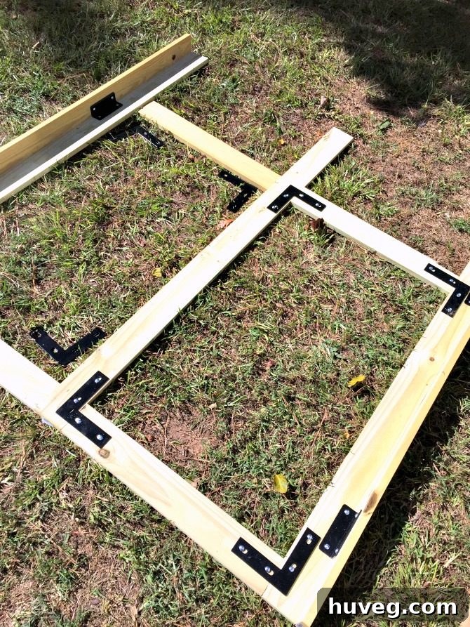 Assembling the Back Section of the Wooden Garden Screen Frame on the Ground