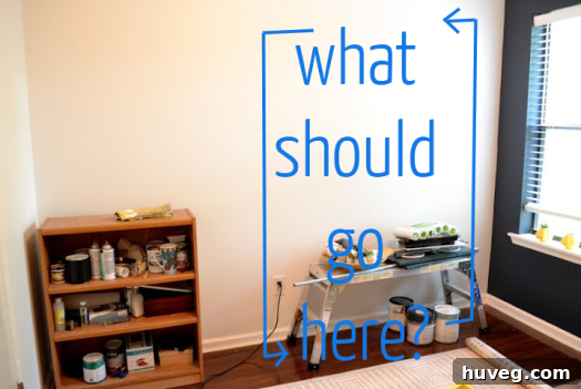 Thoughtful layout of a home office or study-o wall with minimalist desk setup and ample shelving, hinting at future organization possibilities.