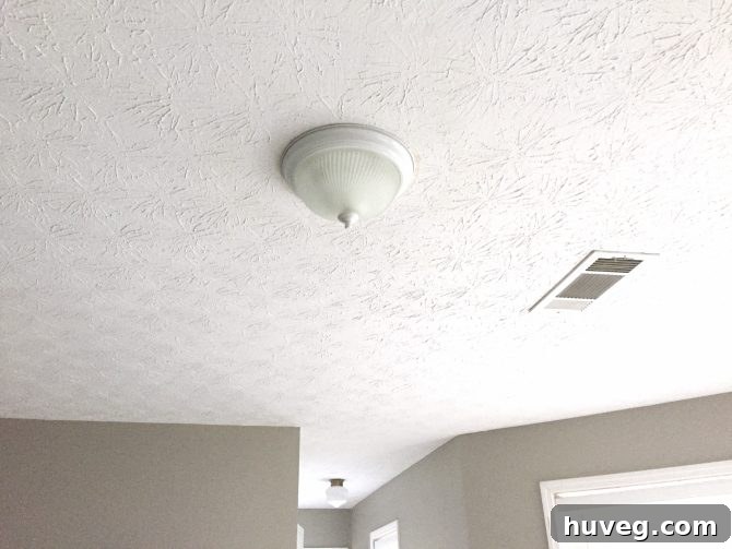 Outdated 'Boob Light' in a Primary Bedroom