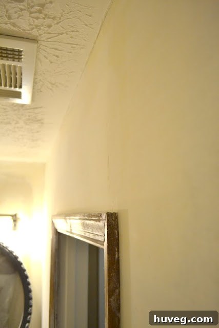 Completed drywall phase, showing smooth, ready-to-paint walls in the guest bathroom.