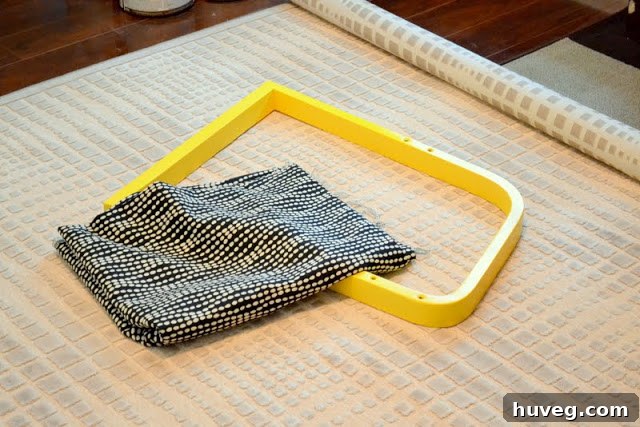 Close-up of fabric and chair leg on office rug