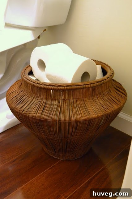 Powder room with a stylish basket holding toilet paper