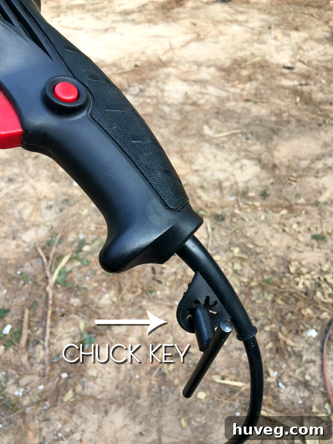 Chuck key located on the end of a hammer drill