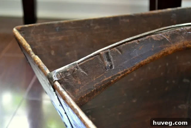 Close-up of the antique Chinese rice bucket's intricate details