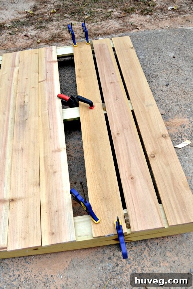Assembling a DIY Outdoor Screen in the Driveway
