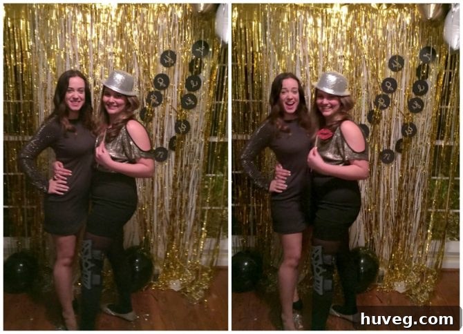 Friends posing in front of a DIY New Year's Eve photo backdrop