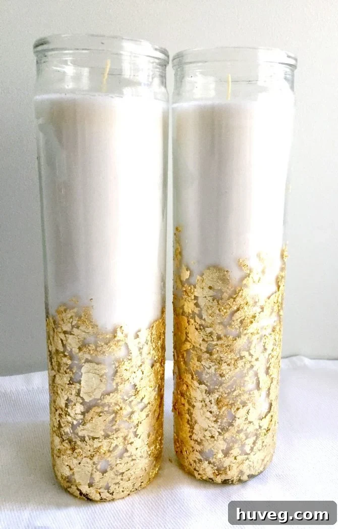 Dollar store candles decorated with gold leaf flakes