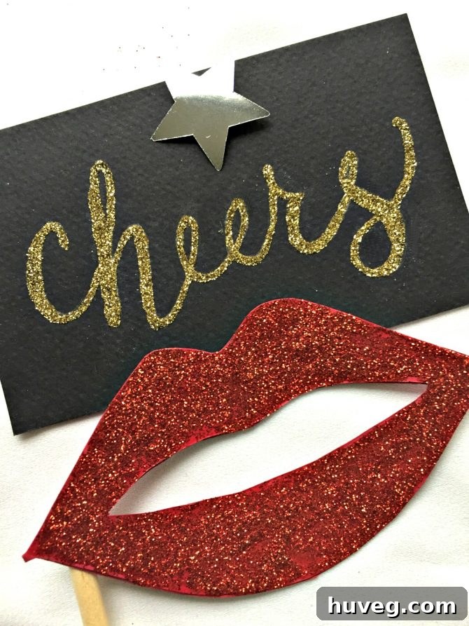 Glitter lips and Cheers photo props for a New Year's Eve party