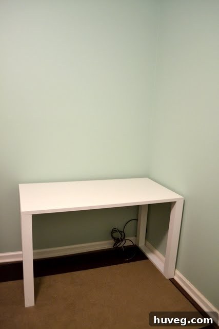 Close-up of the original teal wall, highlighting the initial color choice for the craft room.