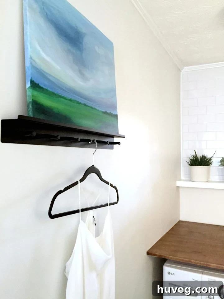 Custom abstract art in a modern laundry room, inspired by Emily Jeffords' style, featuring shades of blue, green, and white