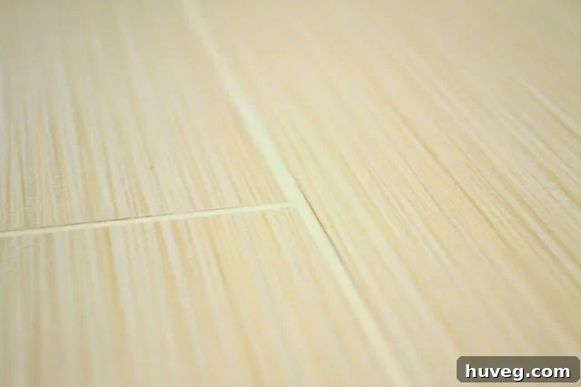 Close-up of tile grout lines, highlighting the need for sealing