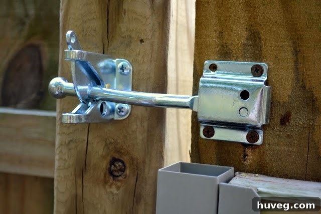 The backyard gate completely closed and secured with the new, functional latch, symbolizing a completed DIY project