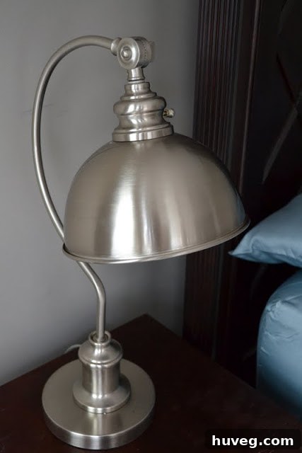The new lamp illuminating a bedside table