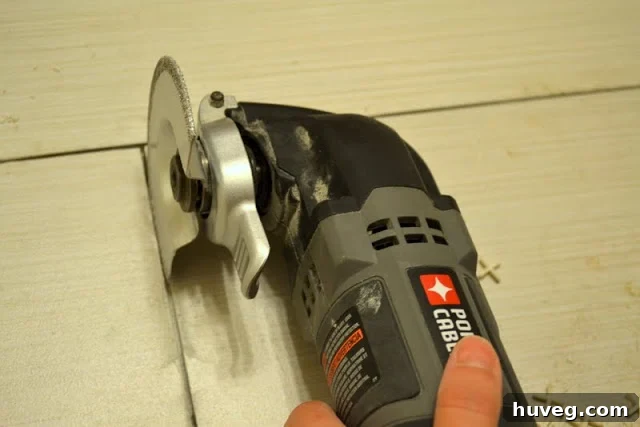 Using an oscillating tool with a grout blade
