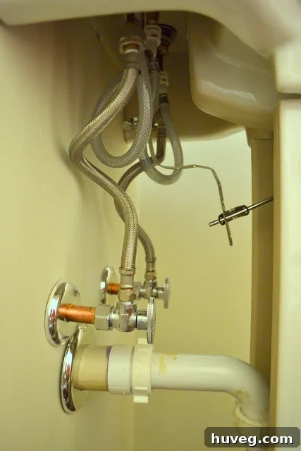 Close-up of a leaky sink drain connection.