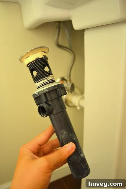 A cracked rubber seal, the source of the sink leak.