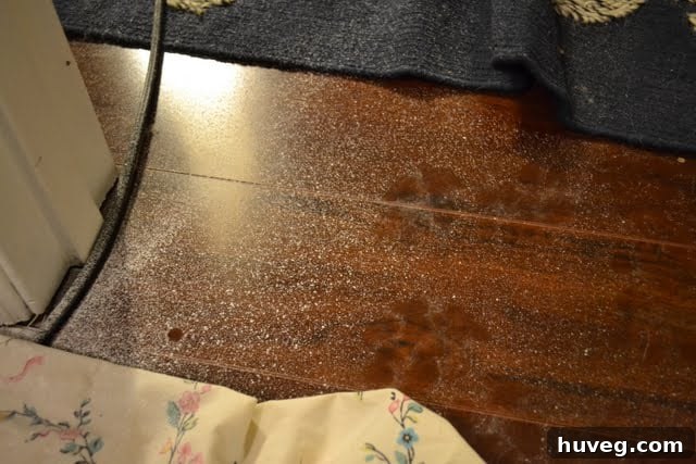 Paint splatters and mess on the floor after a late-night painting session