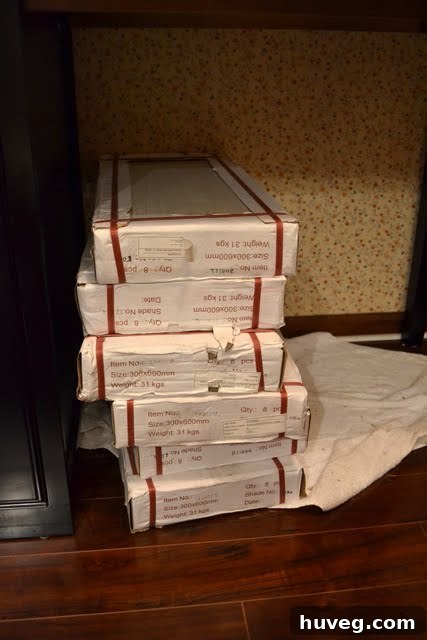 A stack of bathroom tiles sitting untouched, symbolizing a stalled home renovation project.