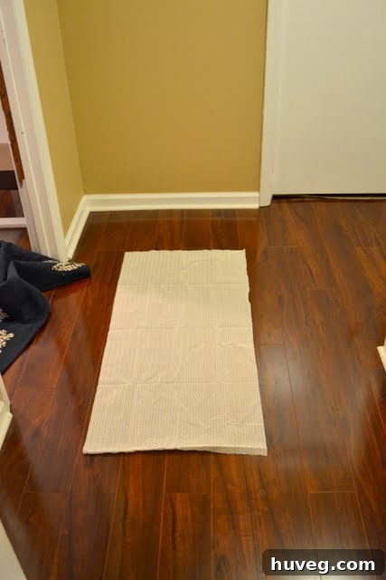 Shelf liner being cut to size for rug pad