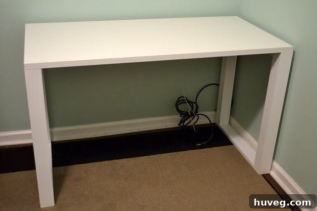 First look at the newly installed sleek modern DIY craft desk in the study-o, showcasing its minimalist design.