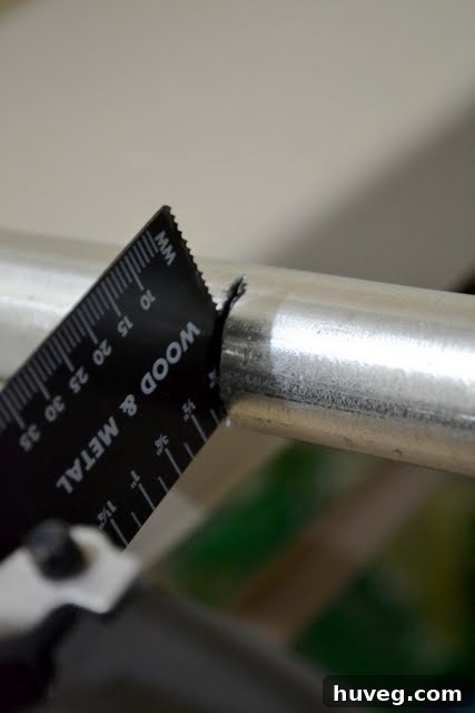 Cutting the metal pipe with the Porter Cable oscillating tool