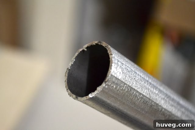 The neatly cut end of the metal pipe