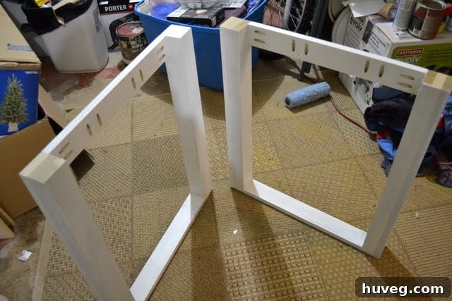 Close-up of the assembled desk frame, highlighting the piece that was temporarily installed upside down.