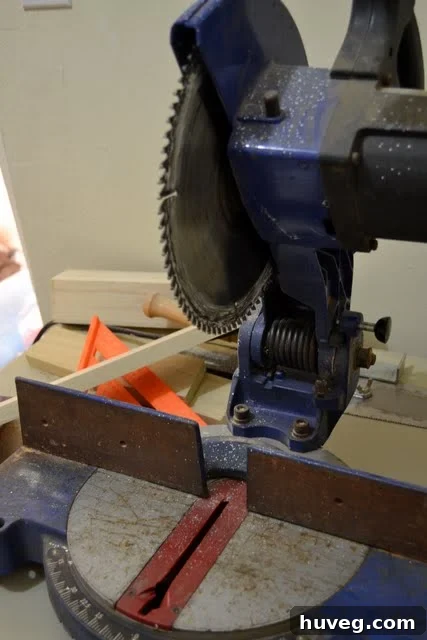 Detail of a primed wood joint, ready for assembly in desk construction