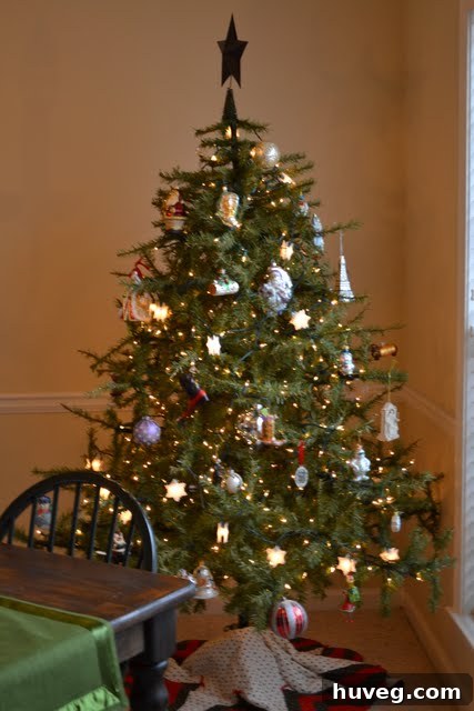 Uncle Knick-Knack, a festive Christmas decoration, observing holiday proceedings.