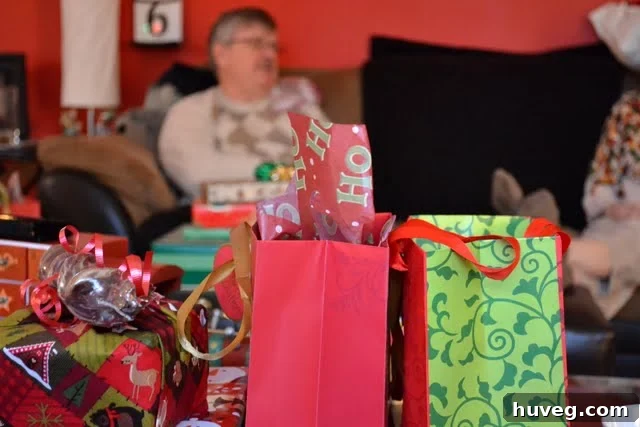 Candid shot of family members laughing and enjoying the Christmas celebration.