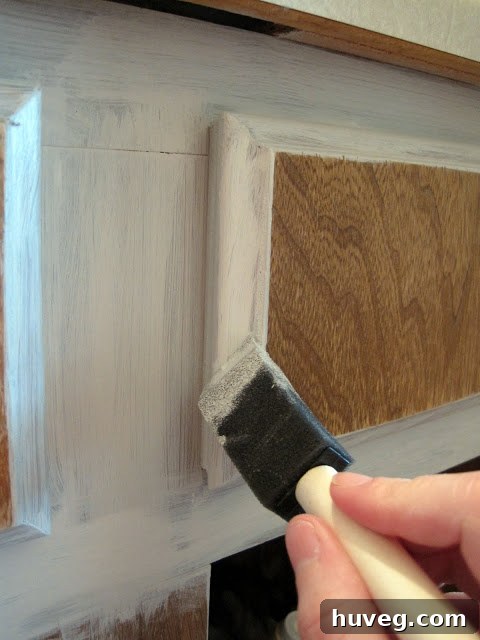 Kitchen cabinets being painted with Rustoleum kit