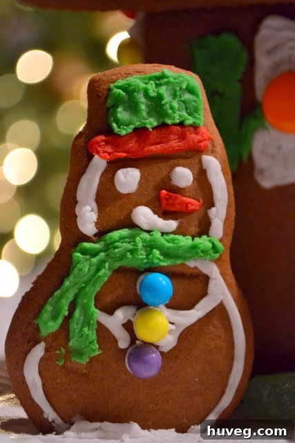 Assembling the gingerbread house walls with icing