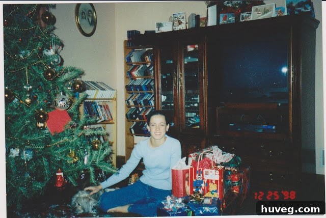 Sarah and the Christmas tree storage bag labeled 'Uncle Knick-Knack', a humorous family tradition