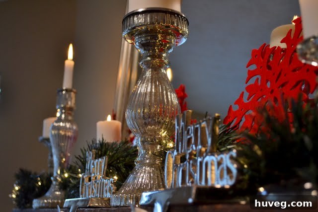 Festive Christmas Mantel with Poinsettias, Candlesticks, and Mirror