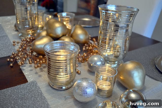 An elegant Christmas table setup bathed in the soft, warm light of sunset, highlighting the sparkling silver and gold decorations.