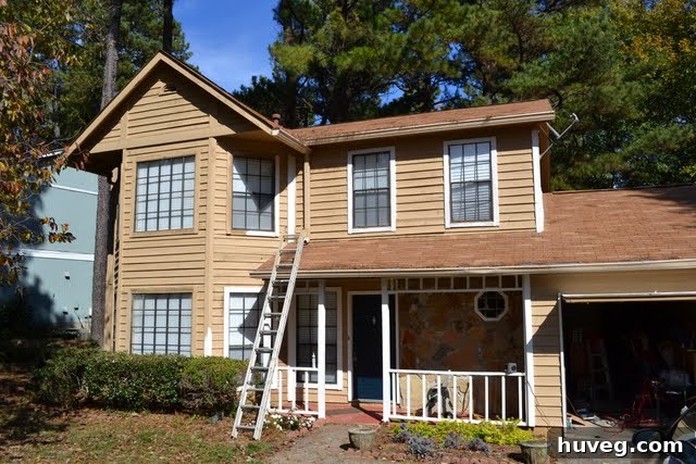 Close-up of freshly painted house siding, demonstrating DIY exterior paint progress