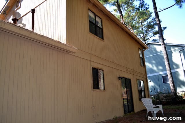 Back of house before trim painting, showing progress on main walls