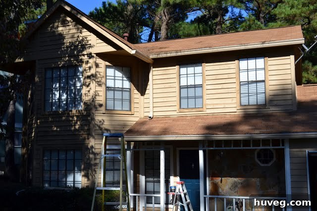 Partially painted house revealing a beautiful new exterior color, 'Basketry' by Behr
