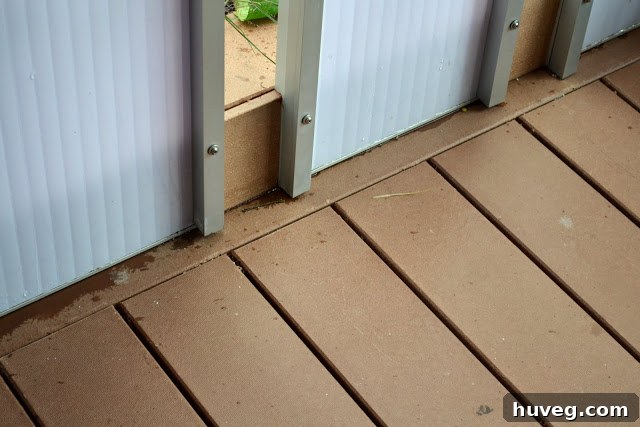 Durable vinyl composite decking used in a sustainable home, showcasing its all-weather resistance and seamless appearance