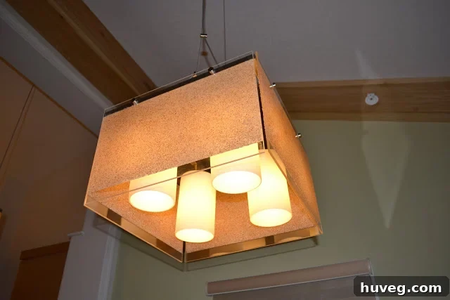 Innovative Lucite light fixture adorned with sand, an inspiring DIY home decor idea