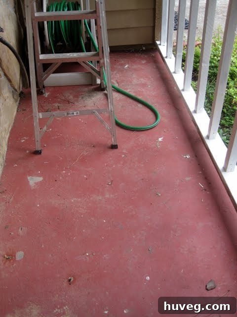 Red painted cement on the front porch before renovation